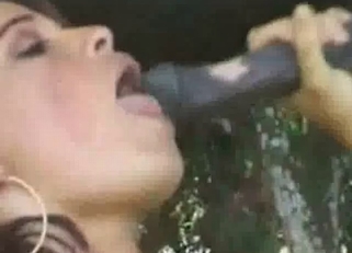 She masturbates as she blows a horse